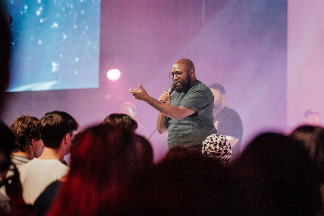 person speaking in front of audience